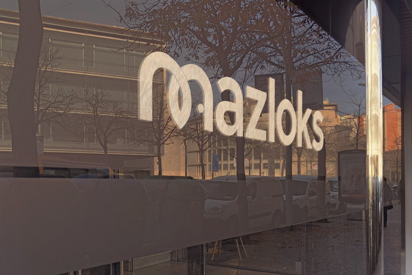 MAZLOKS storefront glass logo